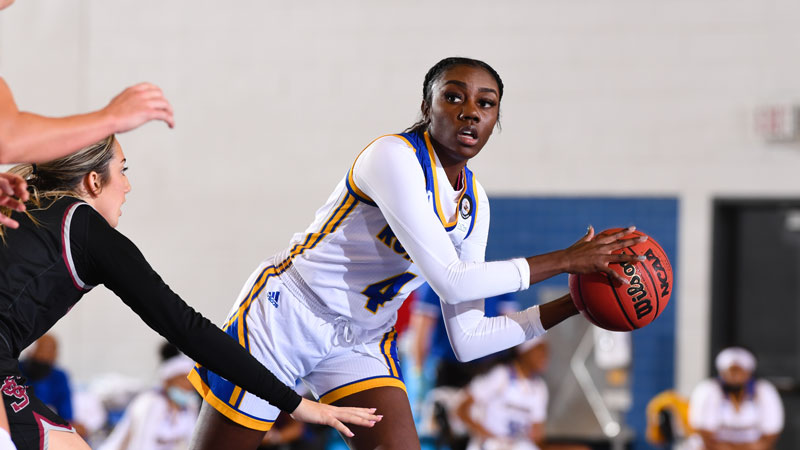 CSUB women's basketball player looking to pass the ball
